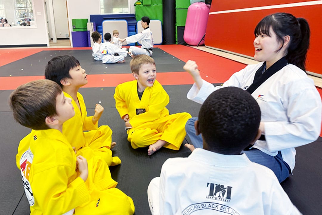 Instructor teaching young students in a positive and fun martial arts class at ABBA Martial Arts in Peachtree City.