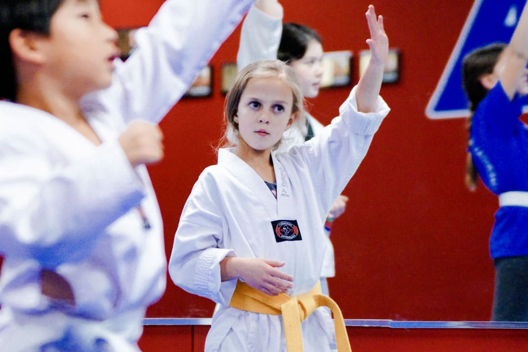 Martial arts class for kids ages 7 to 12 building focus, confidence, and listening skills that carry into the classroom