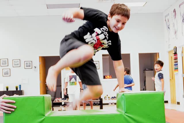 Kids enjoying an obstacle course during a Ninja Birthday Party.