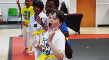 Children practicing Taekwondo with energy and confidence – supporting emotional recovery after bullying | Peachtree City martial arts school